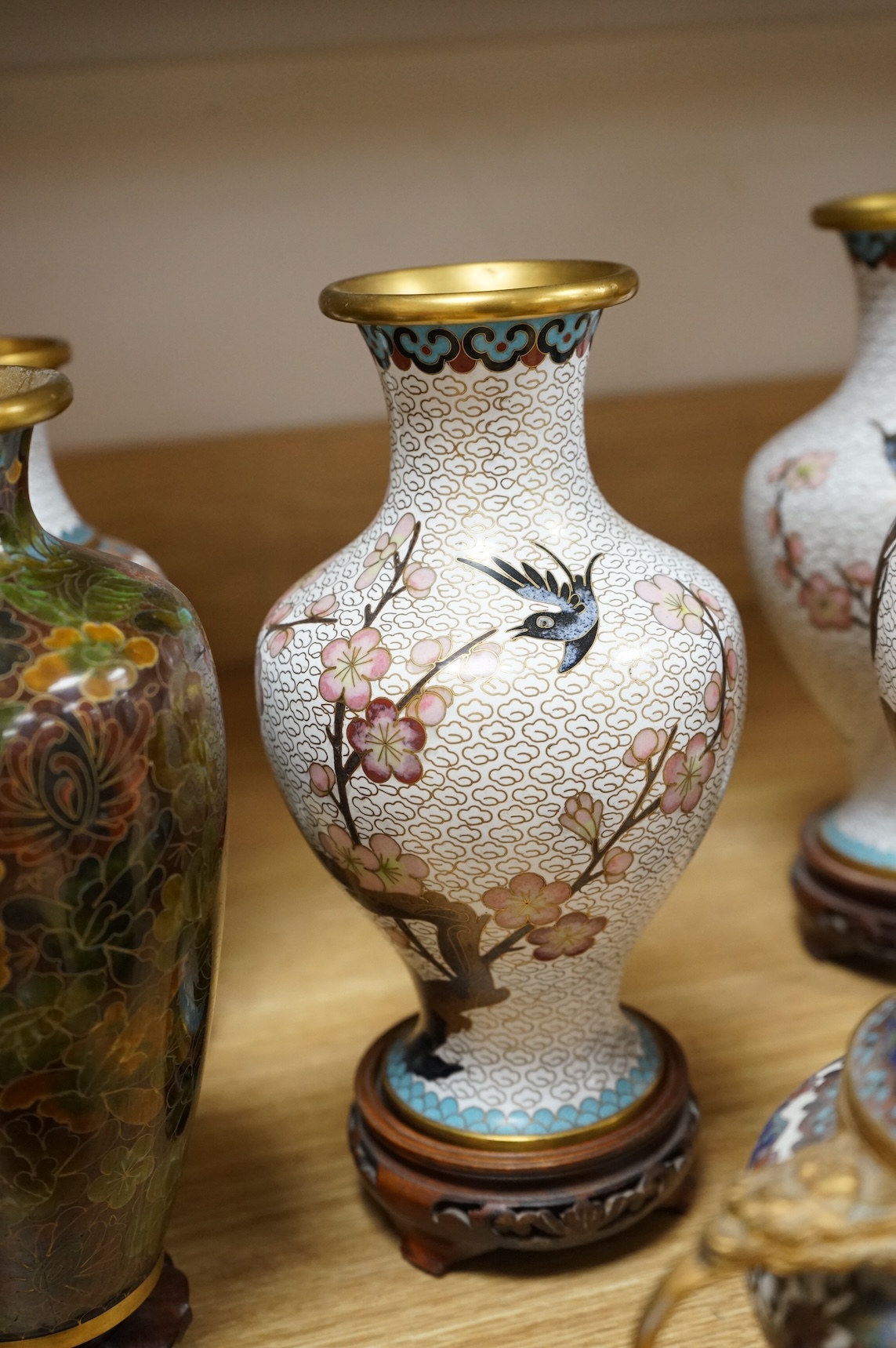 A plique a jour enamel tea bowl together with a collection of cloisonné enamel vases, bowls etc., tallest 26cm